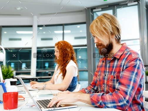 demo-attachment-134-two-co-workers-working-together-PPVW2LA